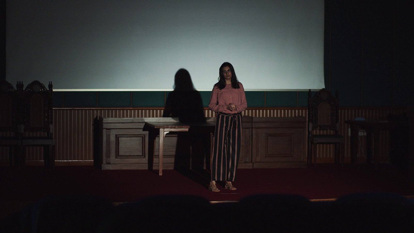 Krinza standing in an auditorium for a Google Developer Student Clubs story